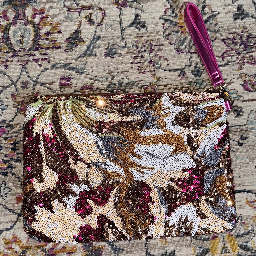 Sequined clutch wristlet with hot pink